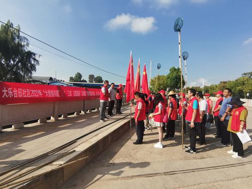 结合“双报到双服务双报告”工作开展“保护黑龙河源头，我们在行动”志愿活动